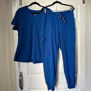 Gently used MedCouture scrubs in Caribbean Blue.